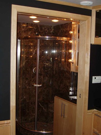 Bathroom w/gorgeous chocolate marble shower and black granite counter